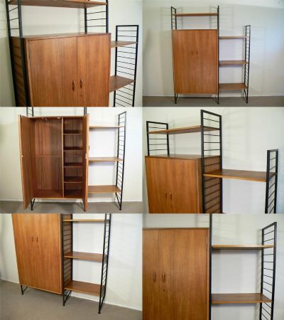 A teak Ladderax system featuring the rare wardrobe module with slide out hanging rail and shelves to the interior. An original Staples system from the 1960s 