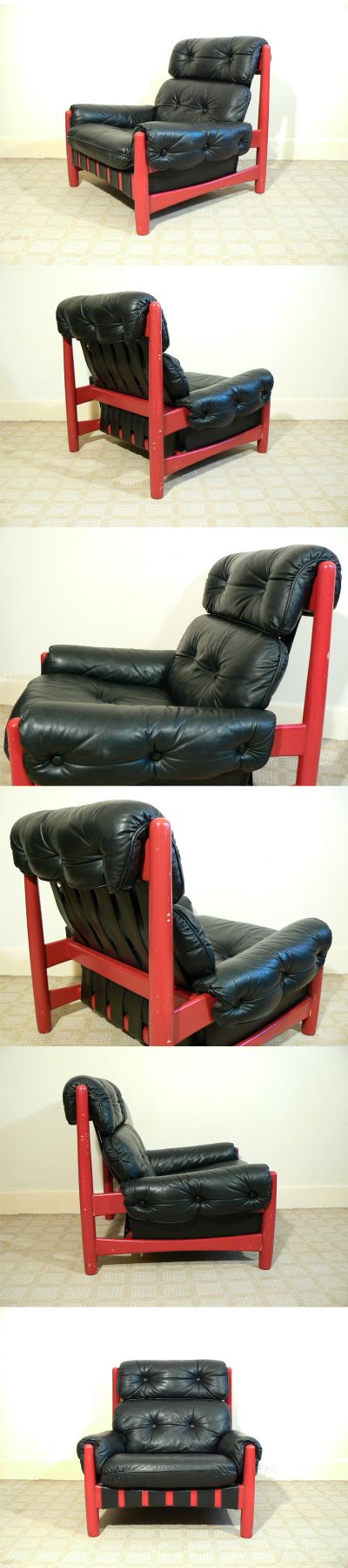 A large black leather armchair, c1970s. Heavily patinated red painted frame with quality black hide. Very heavy and solid and extremely comfortable.
