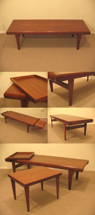 A teak coffee table, made in Denmark c1970s. A highly unusual table, with a matching smaller table and draw/tray, that both slide out of opposing end sections. Charming and rare.